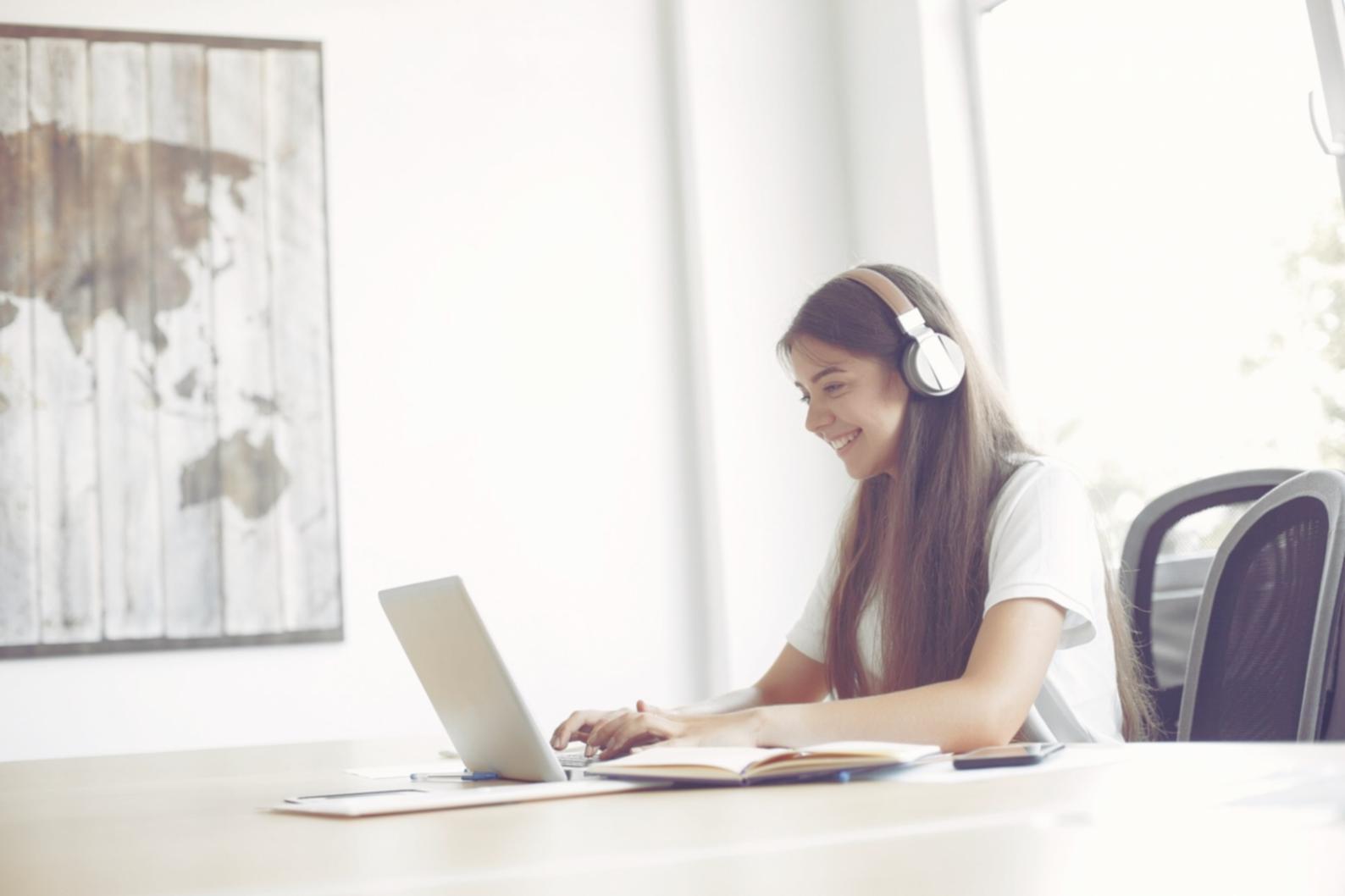 Business planning workspace with financial documents and laptop