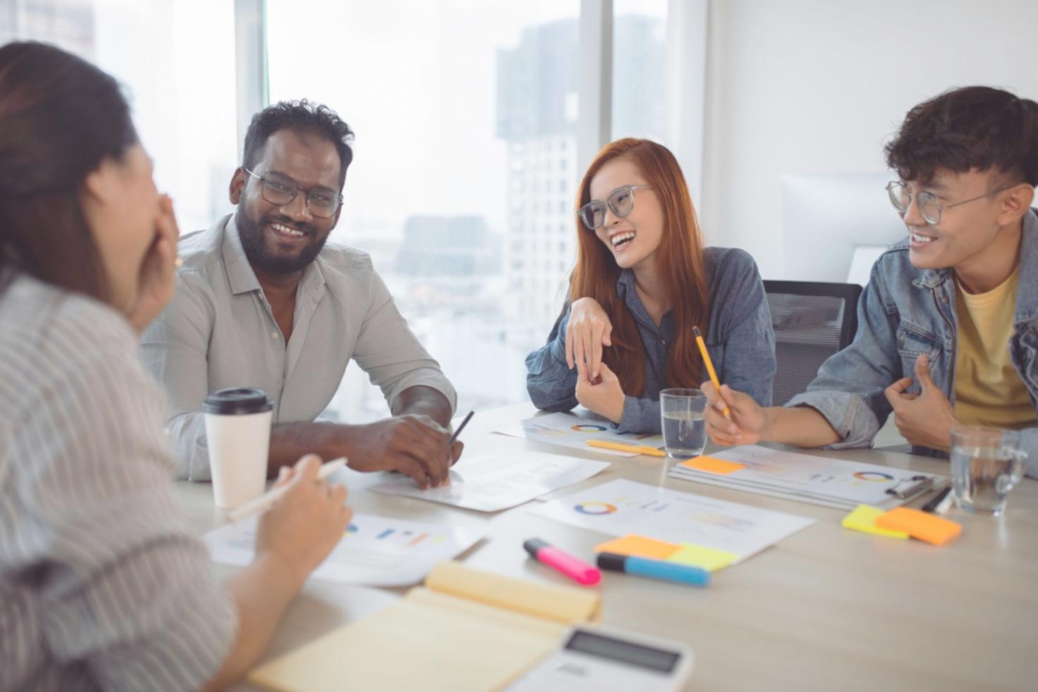 Collaborative workspace with entrepreneurs discussing business strategies